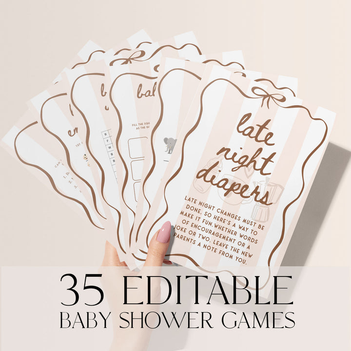 Set of 35 printable baby shower games in blush pink and brown tones, held fan-style in a hand, perfect for fun and interactive baby shower entertainment.