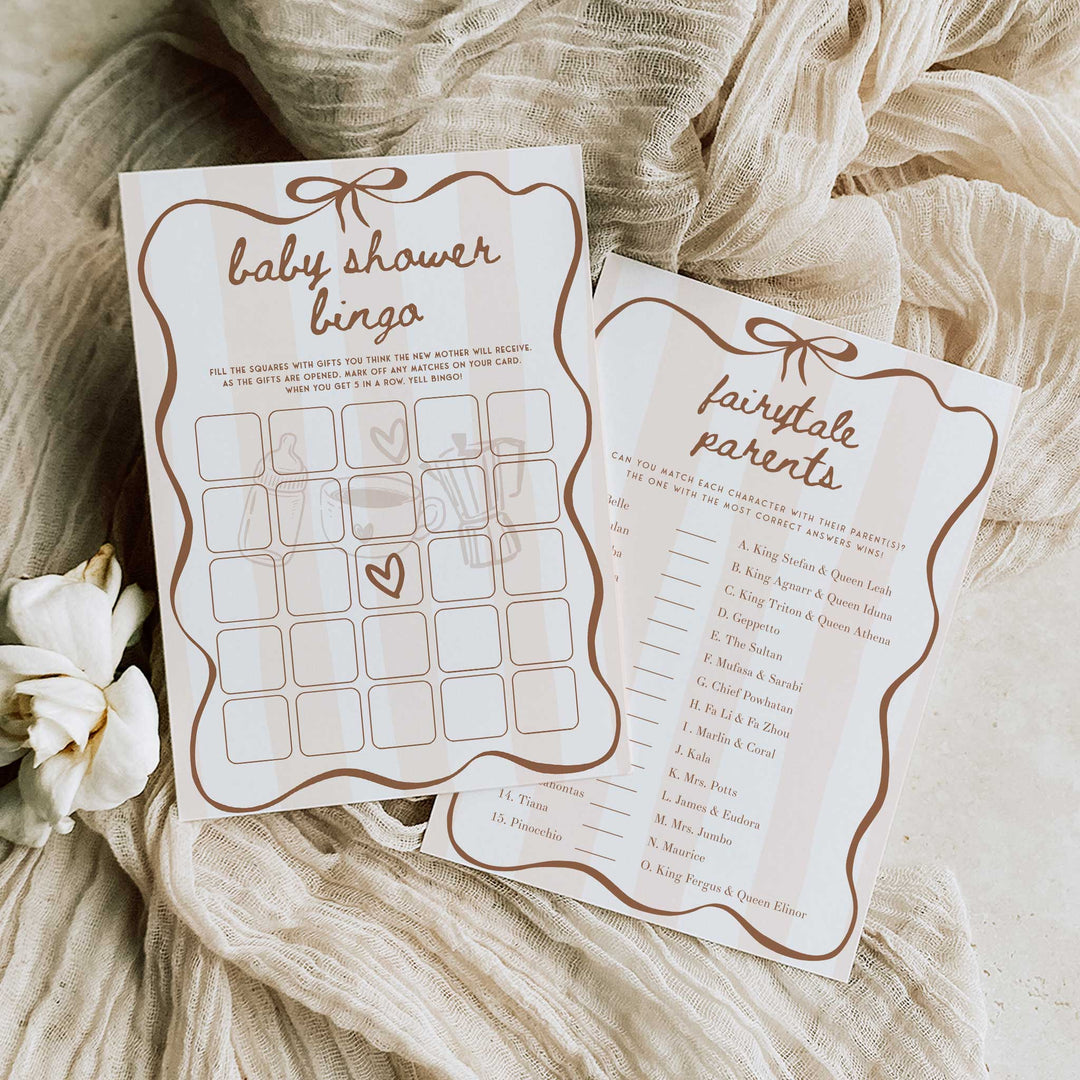 A hand holds fanned-out printable baby shower game cards, including “Late Night Diapers” and word games, for guests to enjoy at baby showers.