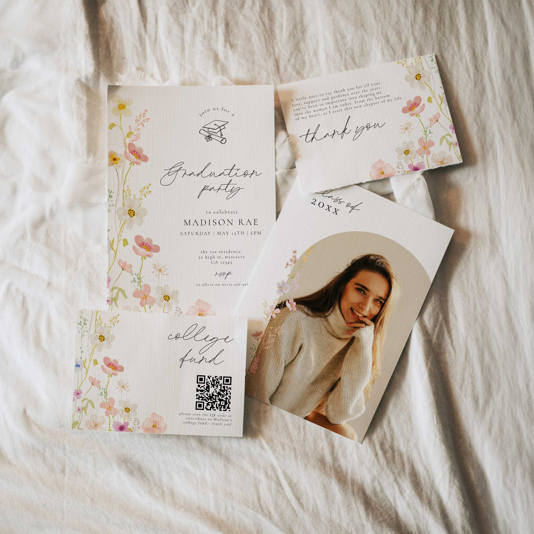 Graduation party invitation set with floral design on a textured surface