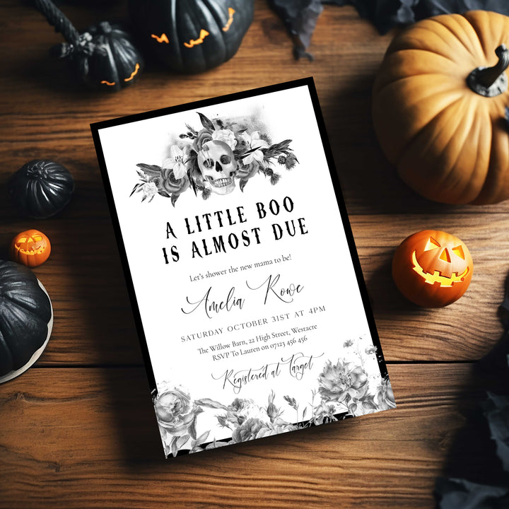 Black and white skull and flowers baby shower invite with gothic lettering and elegant script for expecting mother.
