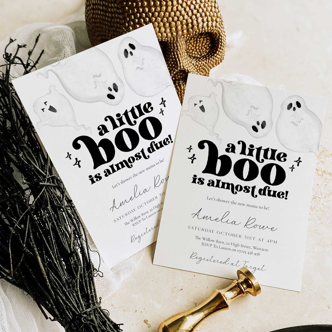 Halloween-themed baby shower invitations with ghosts and text on a neutral background.