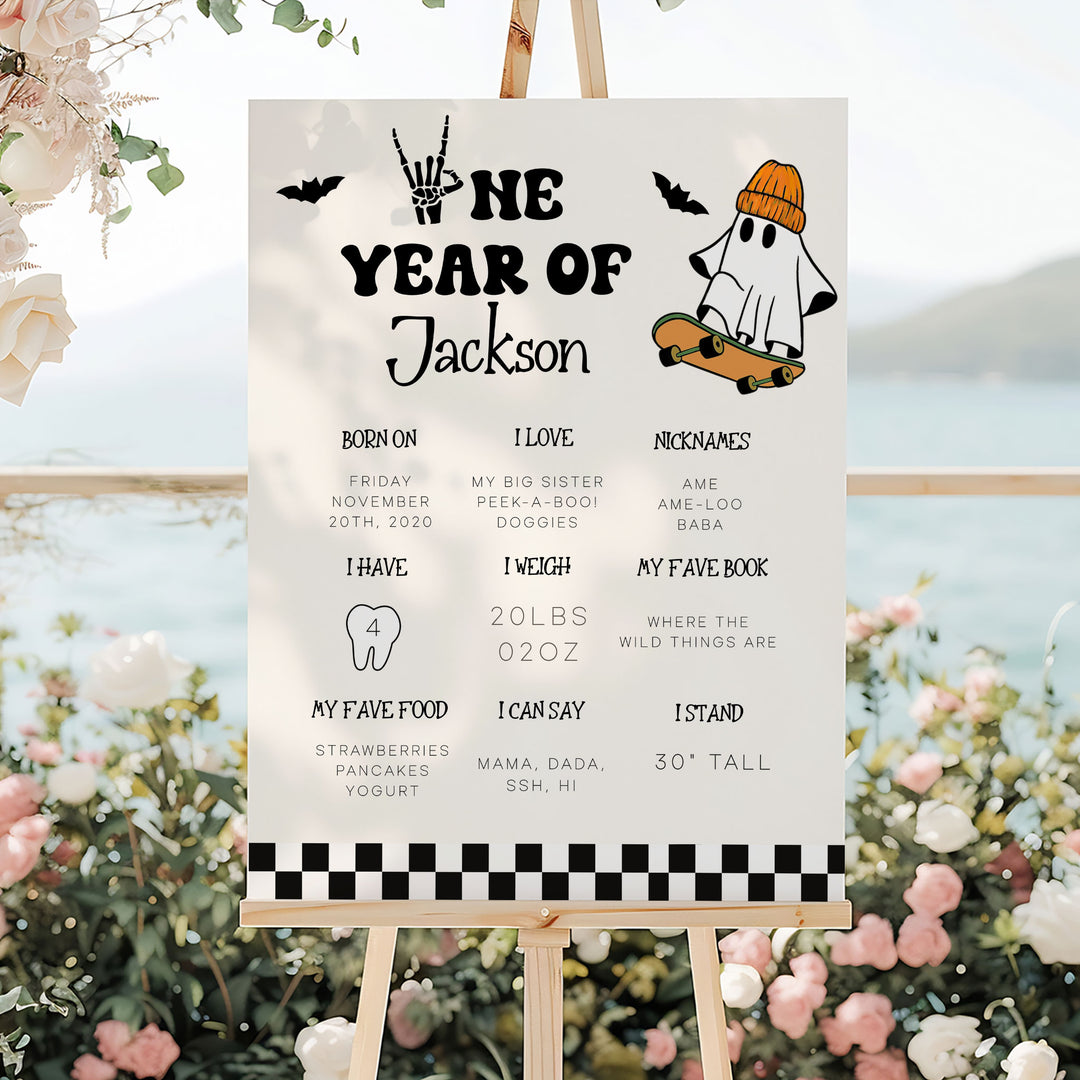 First year birthday board with fun Halloween style and ghost character, ideal photo prop for baby’s October birthday celebration.