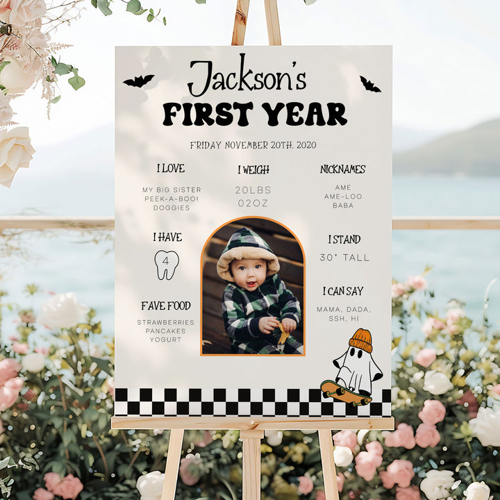 Personalized spooky birthday milestone sign for baby boy Jackson, with Halloween theme and stats like favorite food and book.