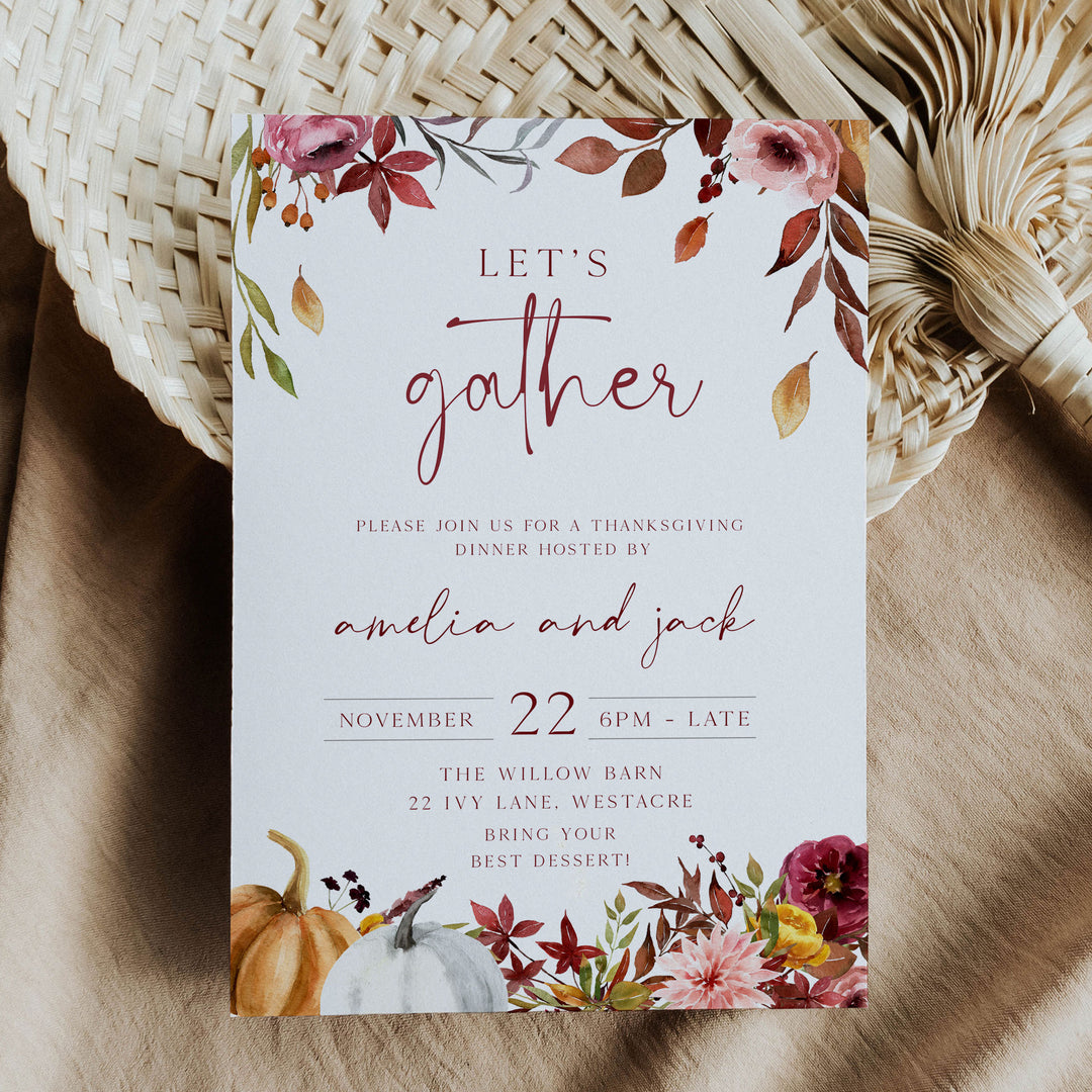 Beautiful Thanksgiving invite for an evening dinner party, hosted at a rustic barn and decorated with fall botanicals.
