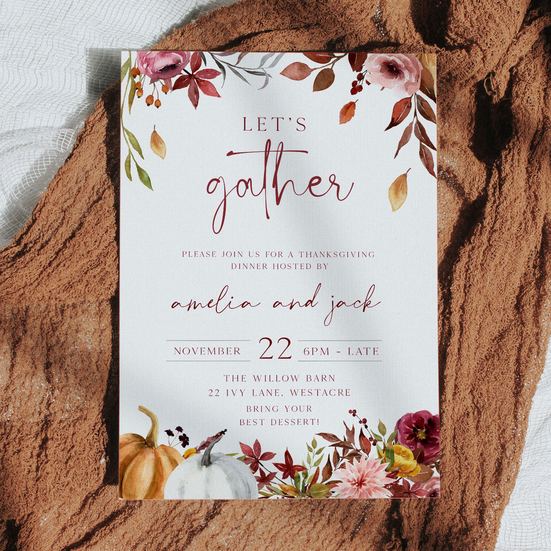 “Let’s Gather” Thanksgiving invite with handwritten script and rustic floral border, ideal for warm seasonal hosting.