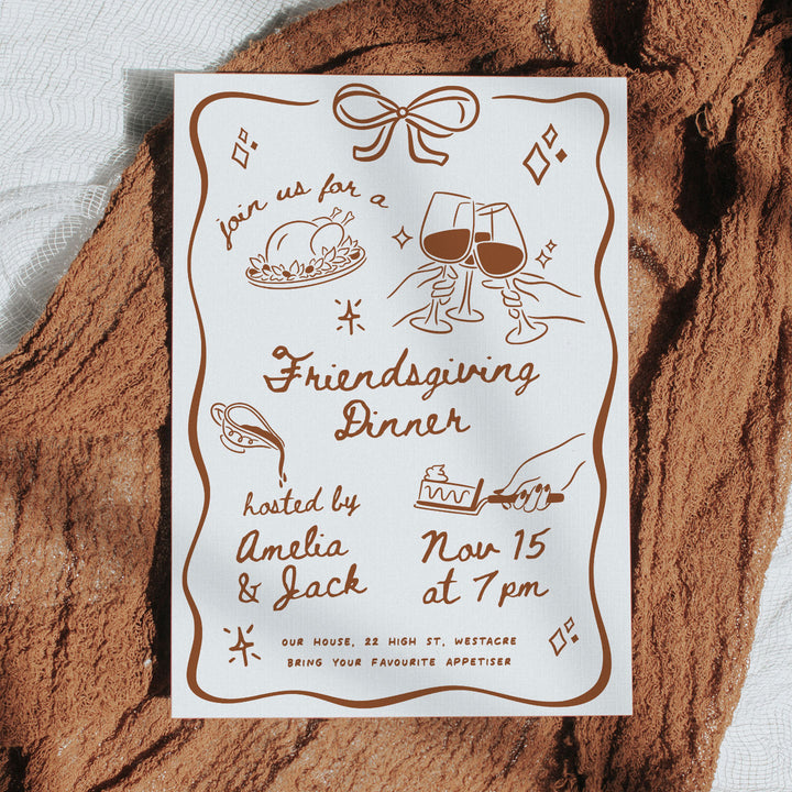 Autumn-themed Friendsgiving invite card styled with mini pumpkins and cozy green cloth, ideal for seasonal dinner party announcements.