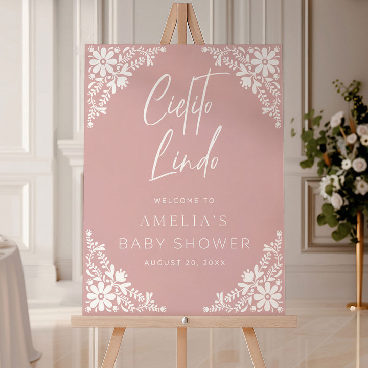 Personalized baby shower sign in dusty rose pink with elegant Cielito Lindo calligraphy and folk-inspired flower accents.