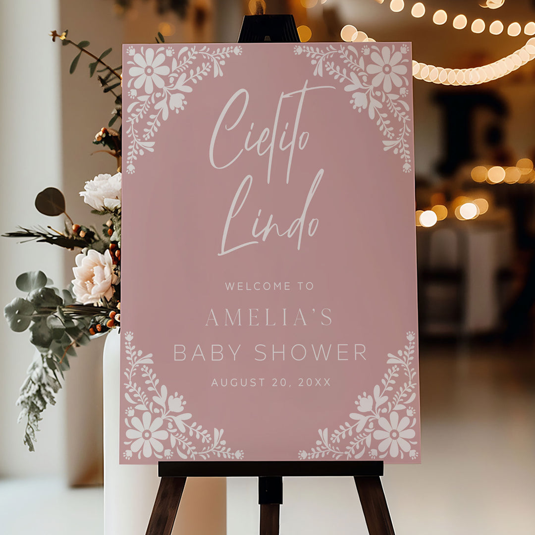 Romantic pink baby shower decor with floral Cielito Lindo signage, ideal for a soft and feminine party theme.