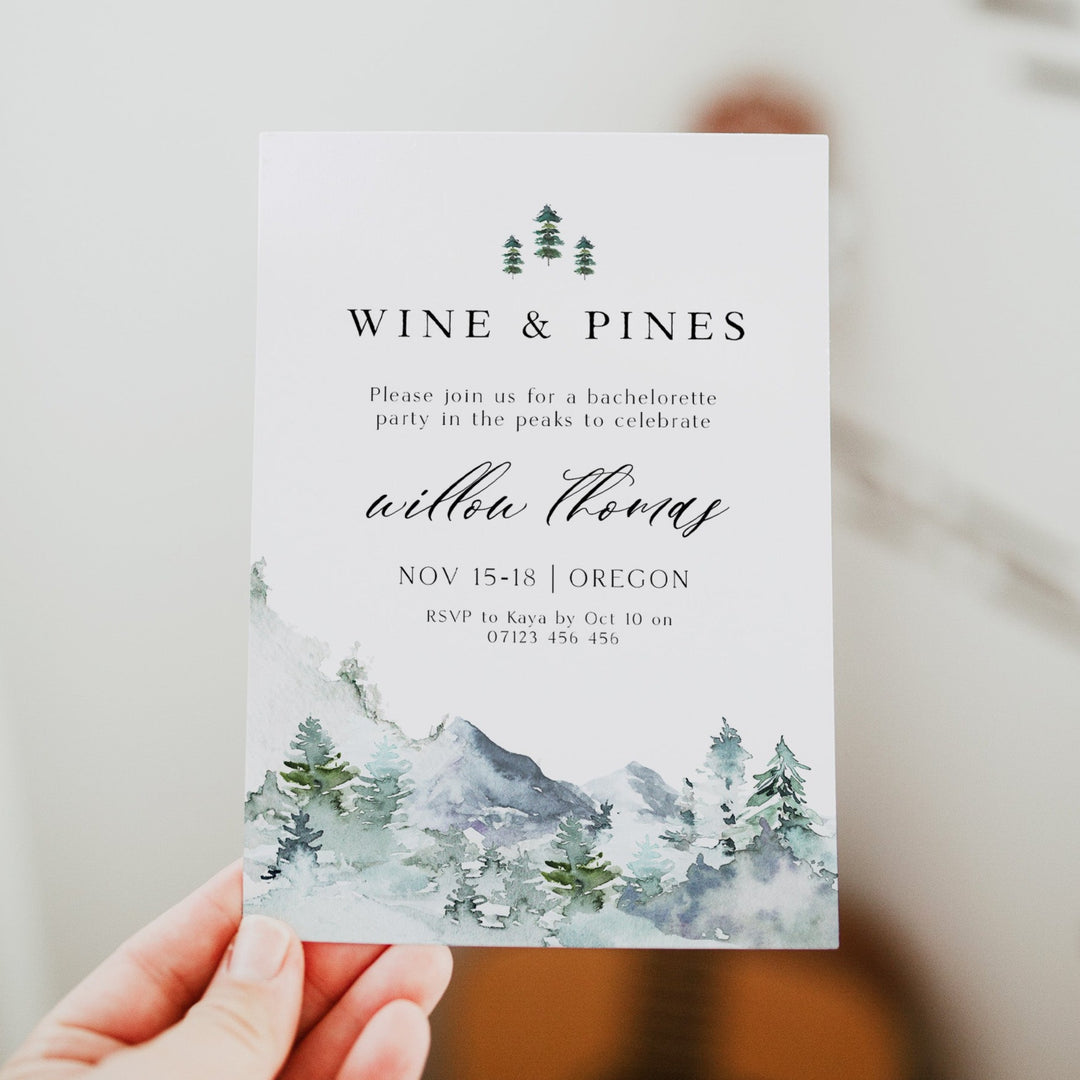 Fully editable and printable wine and pines invitation with a mountain design. Perfect for a snowy cabin mountain bridal shower