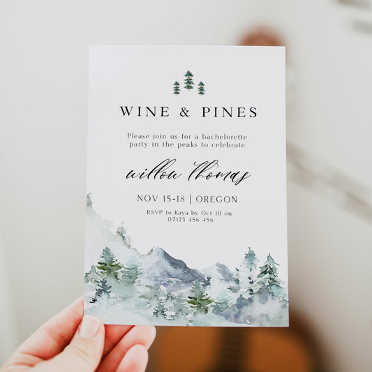 Fully editable and printable wine and pines invitation with a mountain design. Perfect for a snowy cabin mountain bridal shower