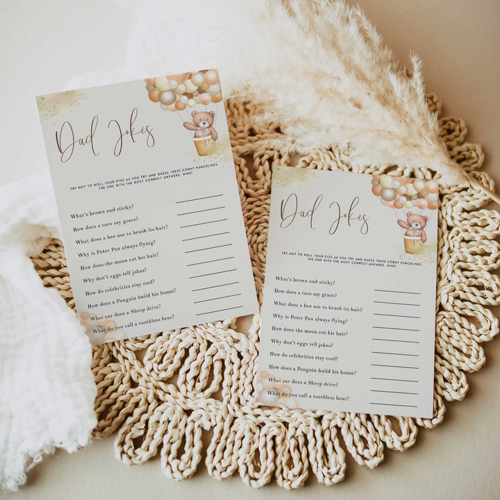 Fully editable and printable baby shower dad jokes game with a hot air balloon teddy bear, we can bearly wait design. Perfect for a We Can Bearly Wait baby shower themed party