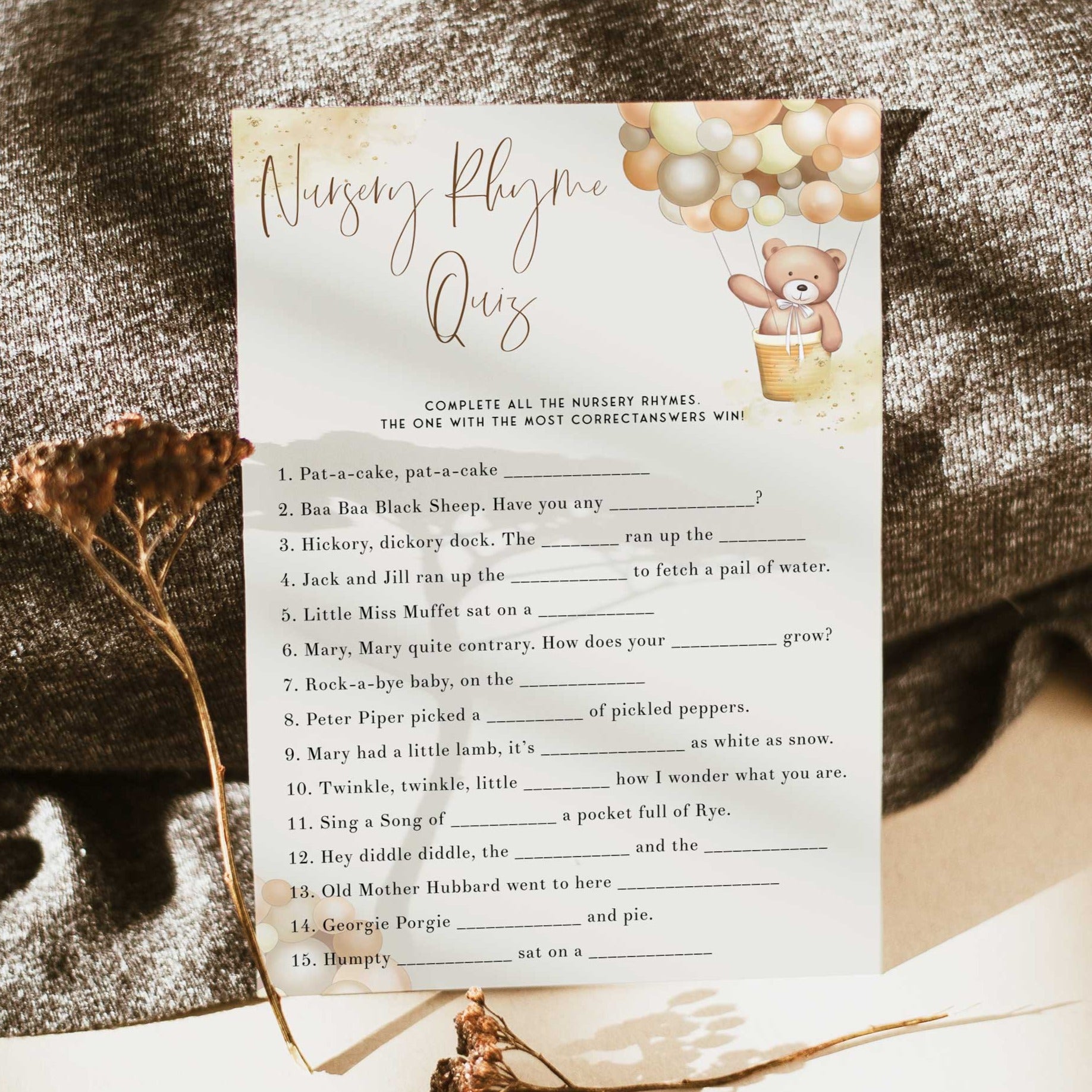 Fully editable and printable baby shower nursery rhyme quiz game with a hot air balloon teddy bear, we can bearly wait design. Perfect for a We Can Bearly Wait baby shower themed party