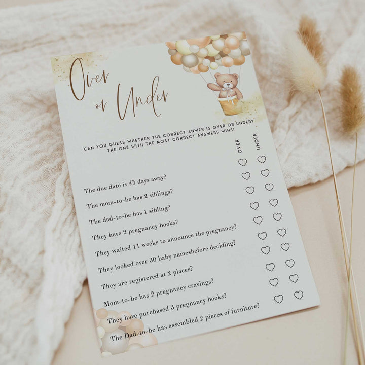 Fully editable and printable baby shower over or under game with a hot air balloon teddy bear, we can bearly wait design. Perfect for a We Can Bearly Wait baby shower themed party