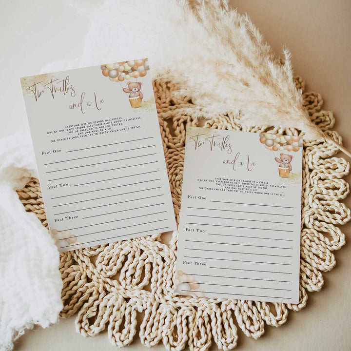 Fully editable and printable baby shower two truths and a lie game with a hot air balloon teddy bear, we can bearly wait design. Perfect for a We Can Bearly Wait baby shower themed party