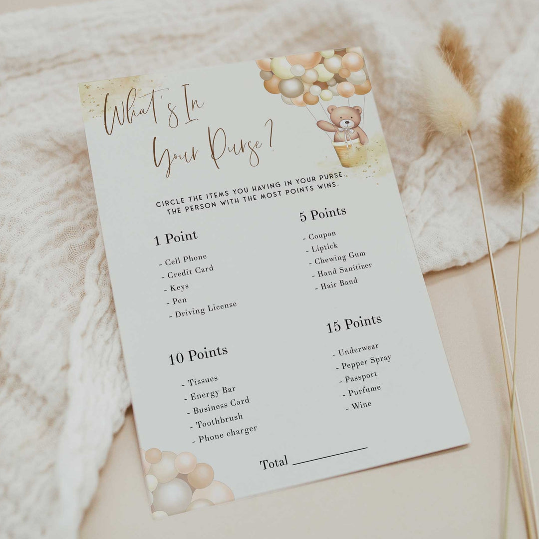 Fully editable and printable baby shower what's in your purse game with a hot air balloon teddy bear, we can bearly wait design. Perfect for a We Can Bearly Wait baby shower themed party