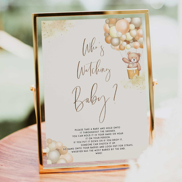 Fully editable and printable baby shower who's watching baby game with a hot air balloon teddy bear, we can bearly wait design. Perfect for a We Can Bearly Wait baby shower themed party