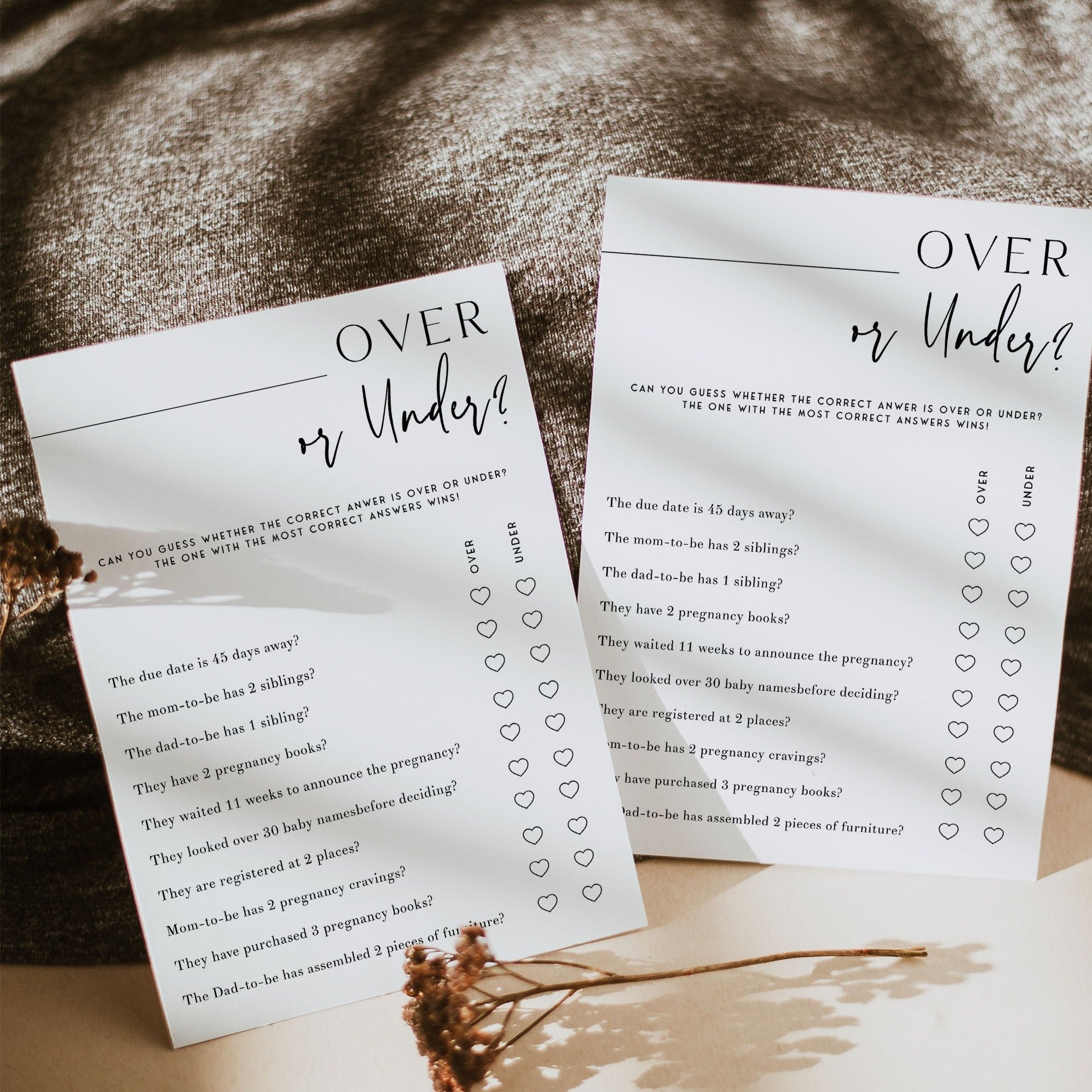 Printable baby shower game Over or Under with a modern minimalist design