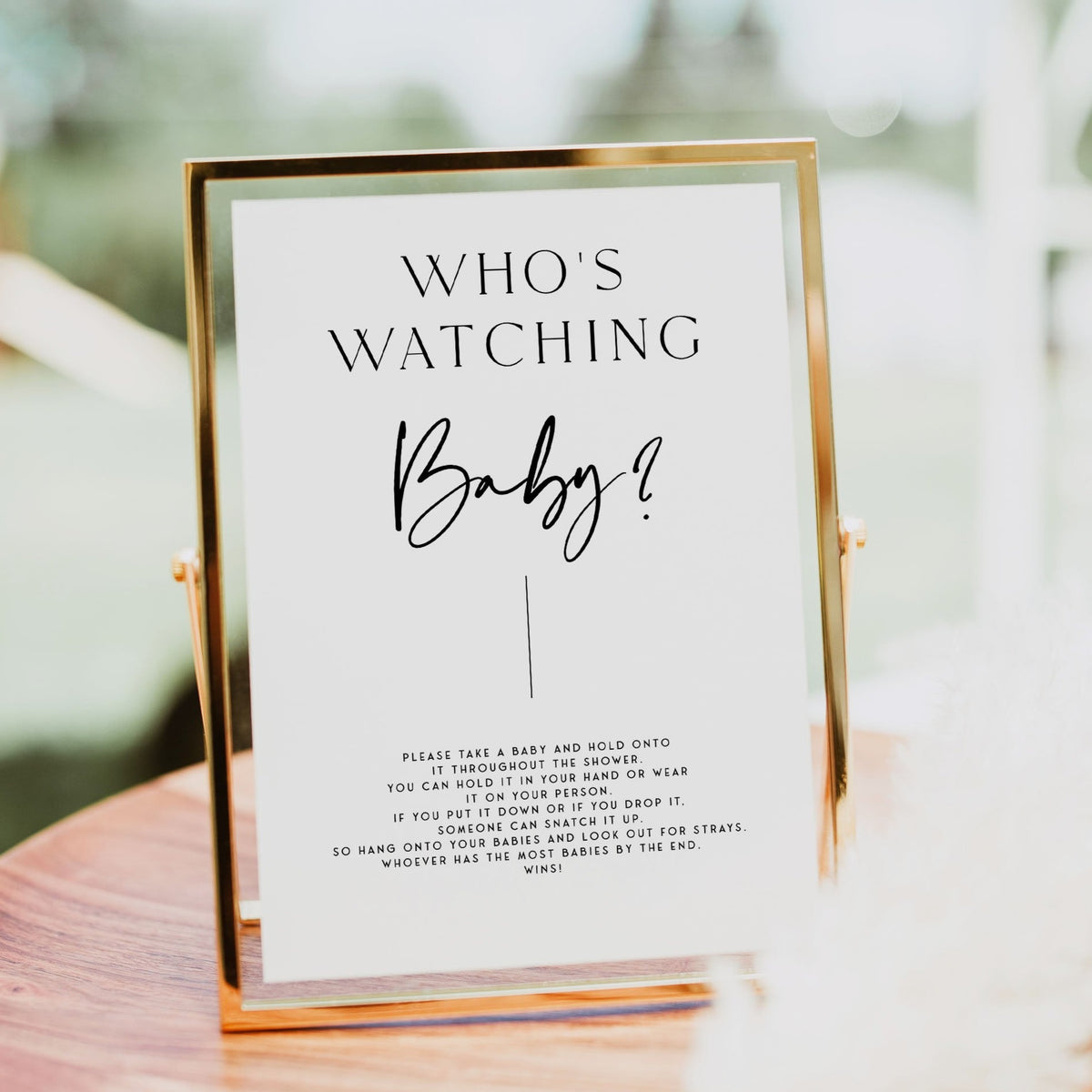 Printable baby shower game Who's Watching Baby with a modern minimalist design